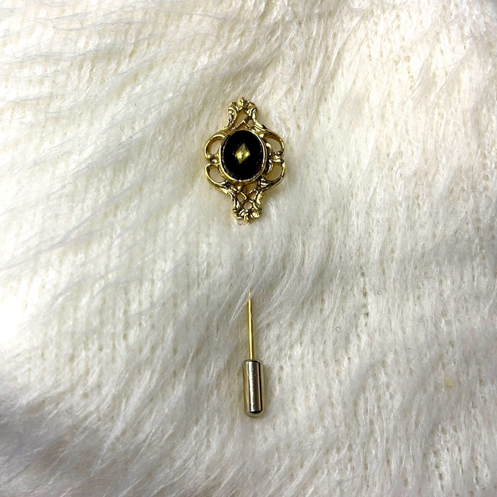 Vintage gold tone onyx stick pin.